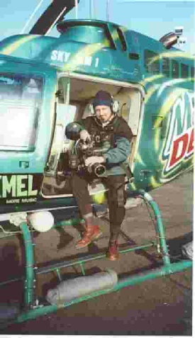 Image of Ian Perry preparing to film from a helicoptor over San Francisco